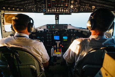 two pilots flying an airplane